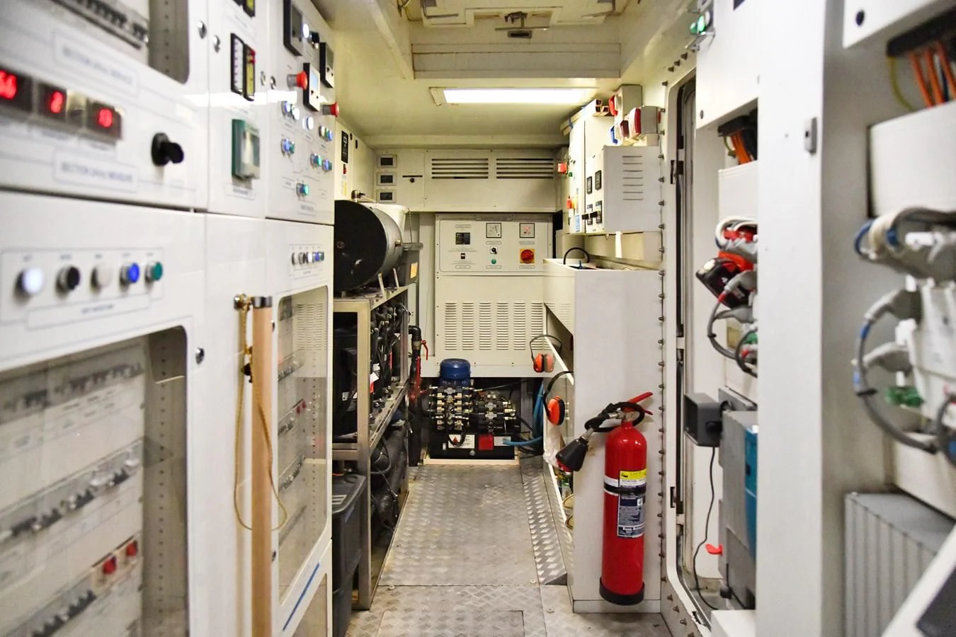 a room with white cabinets and equipment aboard CUSTOM LINE 100 Yacht for Sale
