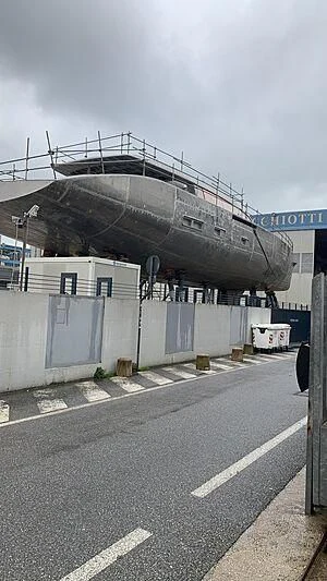 a building with a fence around it aboard PERINI 47-M Yacht for Sale