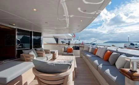 a room with a bed and a large window aboard AWAY Yacht for Charter