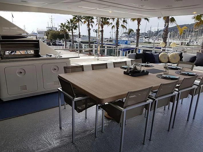 a large kitchen with a table and chairs aboard AWAY Yacht for Charter