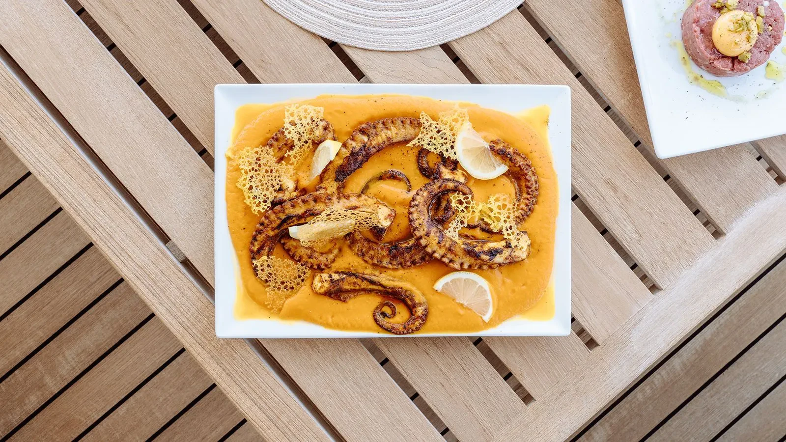 a plate of food aboard AWAY Yacht for Charter