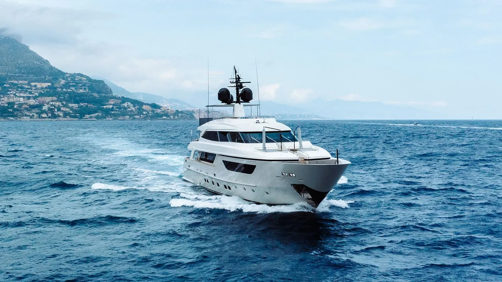 a white boat in the water aboard AWAY Yacht for Charter