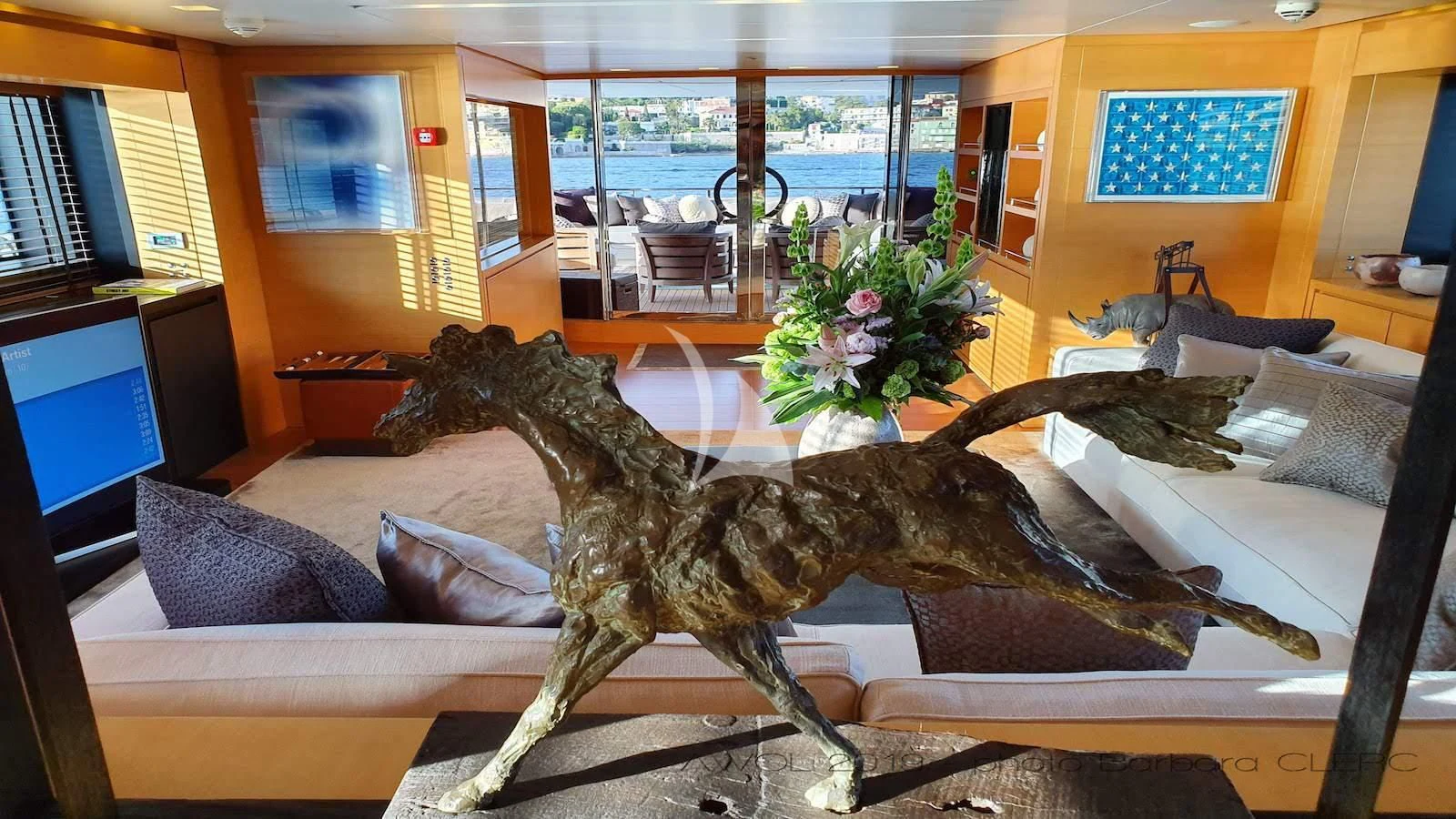 a large dinosaur statue aboard AWAY Yacht for Charter