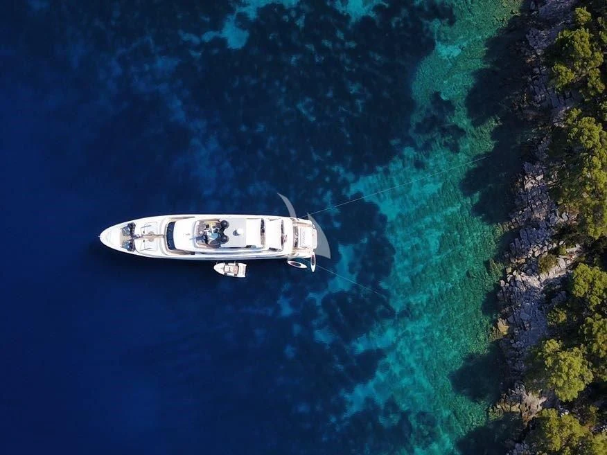 a white boat in the water aboard AWAY Yacht for Charter