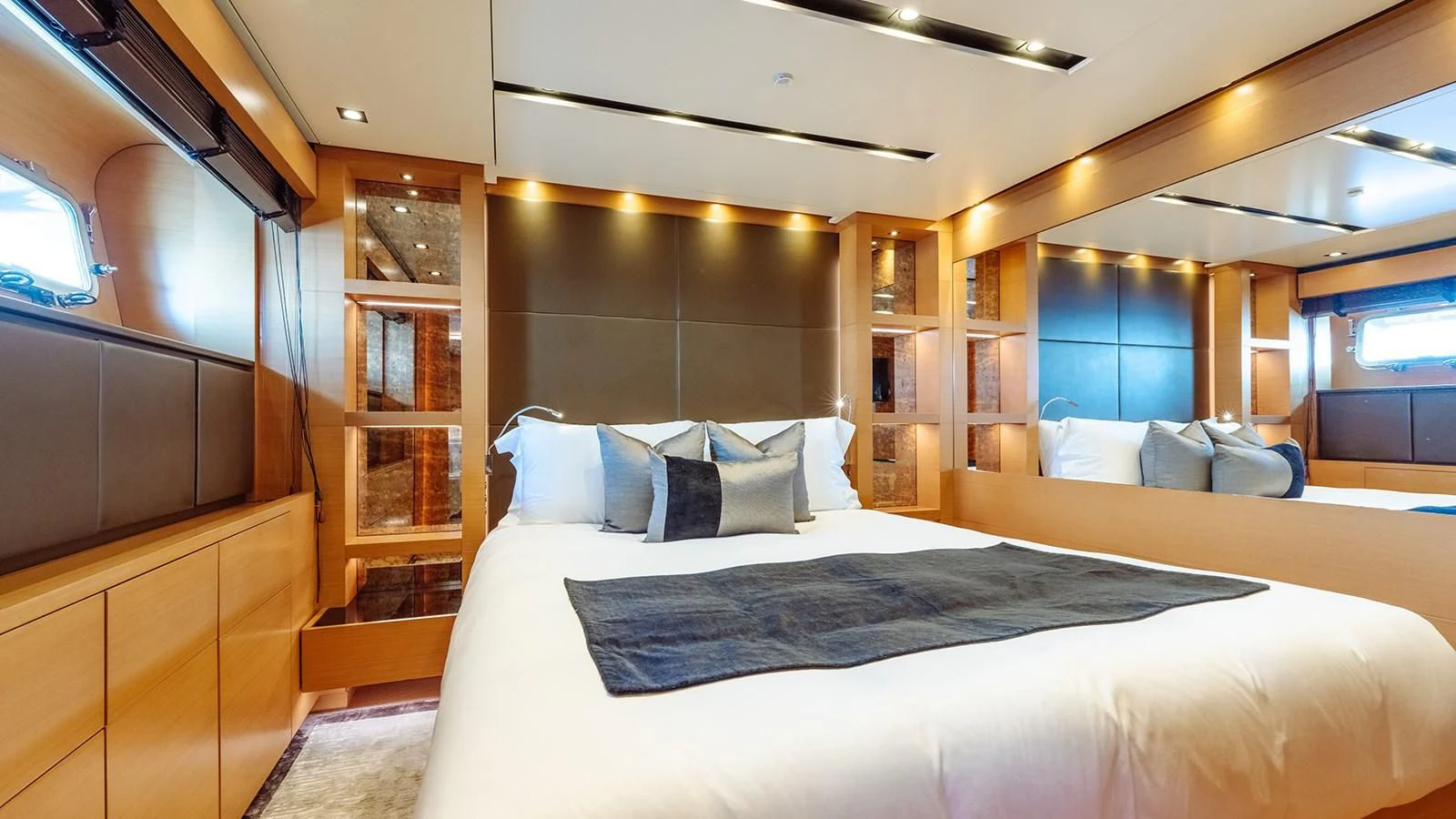 a room with a bed and a window aboard AWAY Yacht for Charter