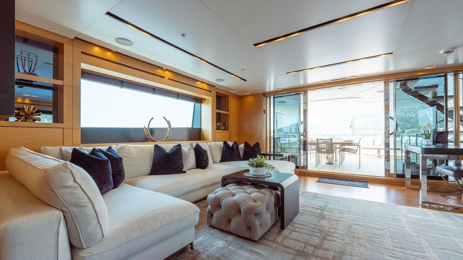 a living room with a large window aboard AWAY Yacht for Charter