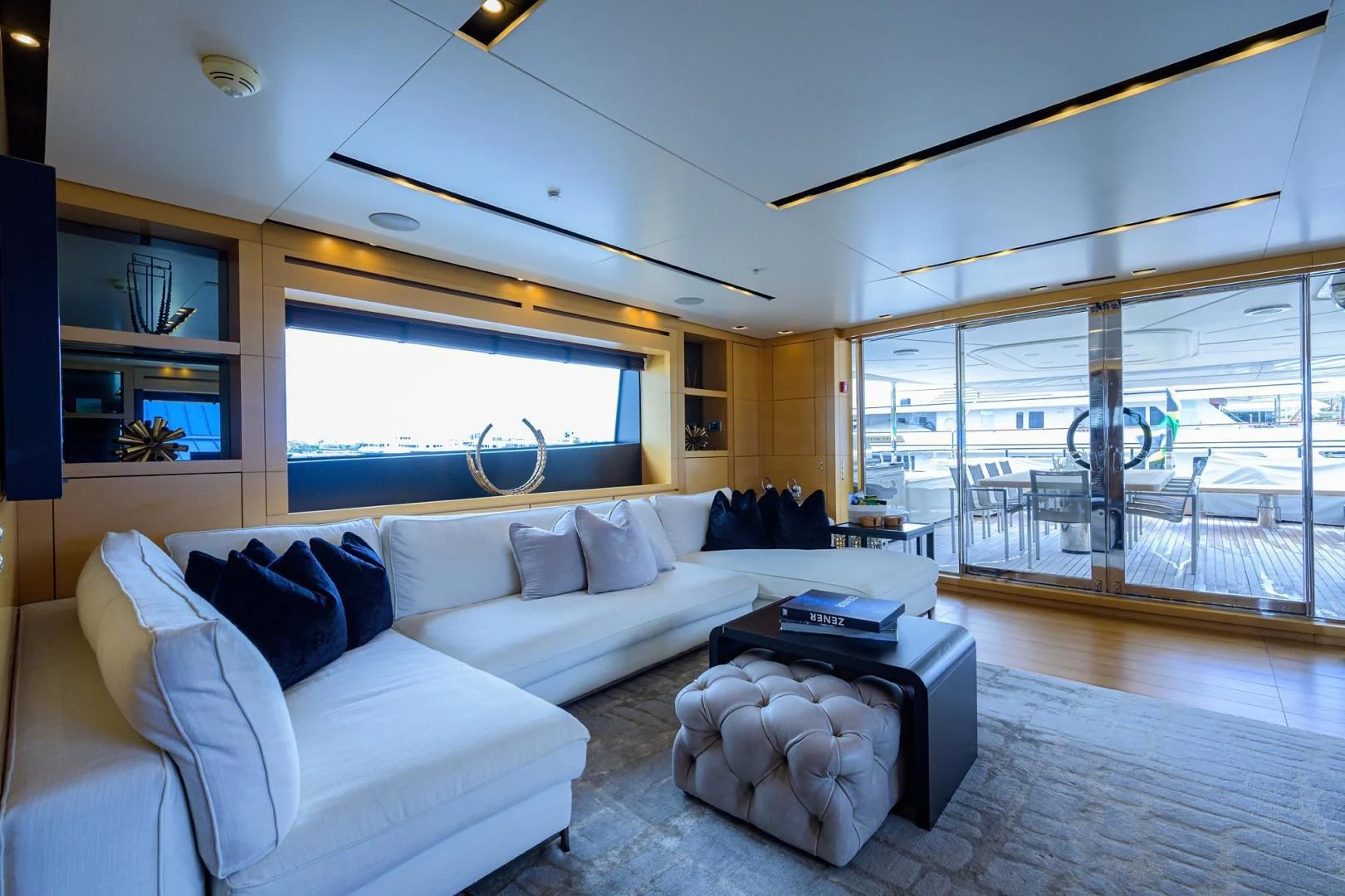 a living room with a large window aboard AWAY Yacht for Charter