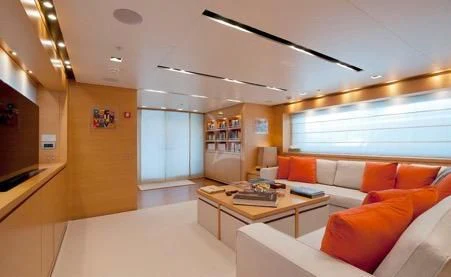 a living room with a large window aboard AWAY Yacht for Charter