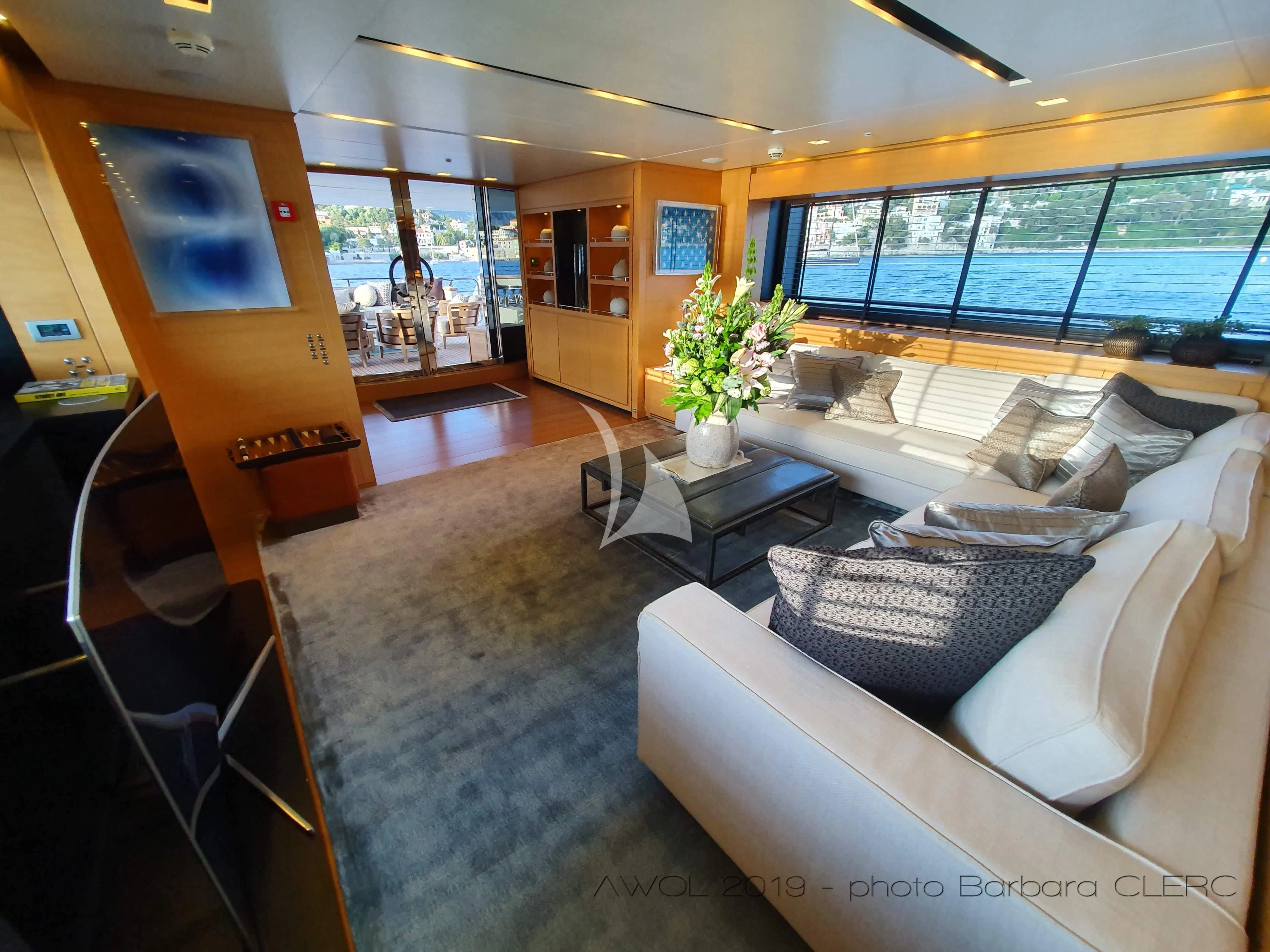 a living room with a large window aboard AWAY Yacht for Charter
