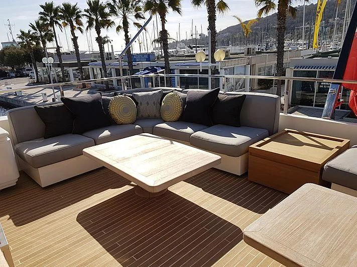 a couch with pillows on it aboard AWAY Yacht for Charter