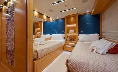 a room with a couple of beds aboard AWAY Yacht for Charter