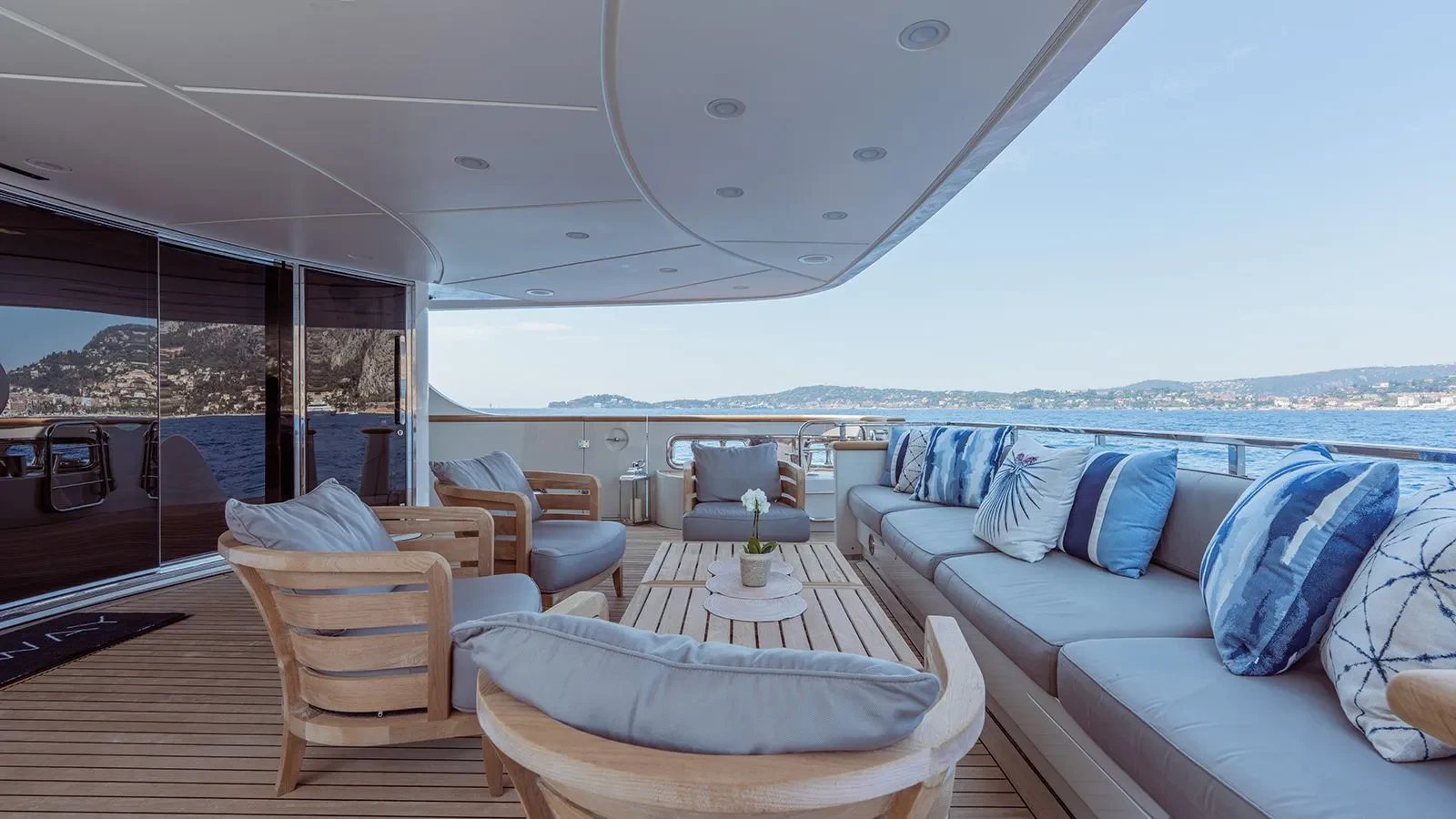 a large living room with a view of the ocean aboard AWAY Yacht for Charter
