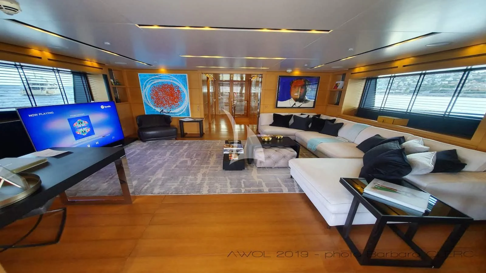 a room with a couch and a table aboard AWAY Yacht for Charter