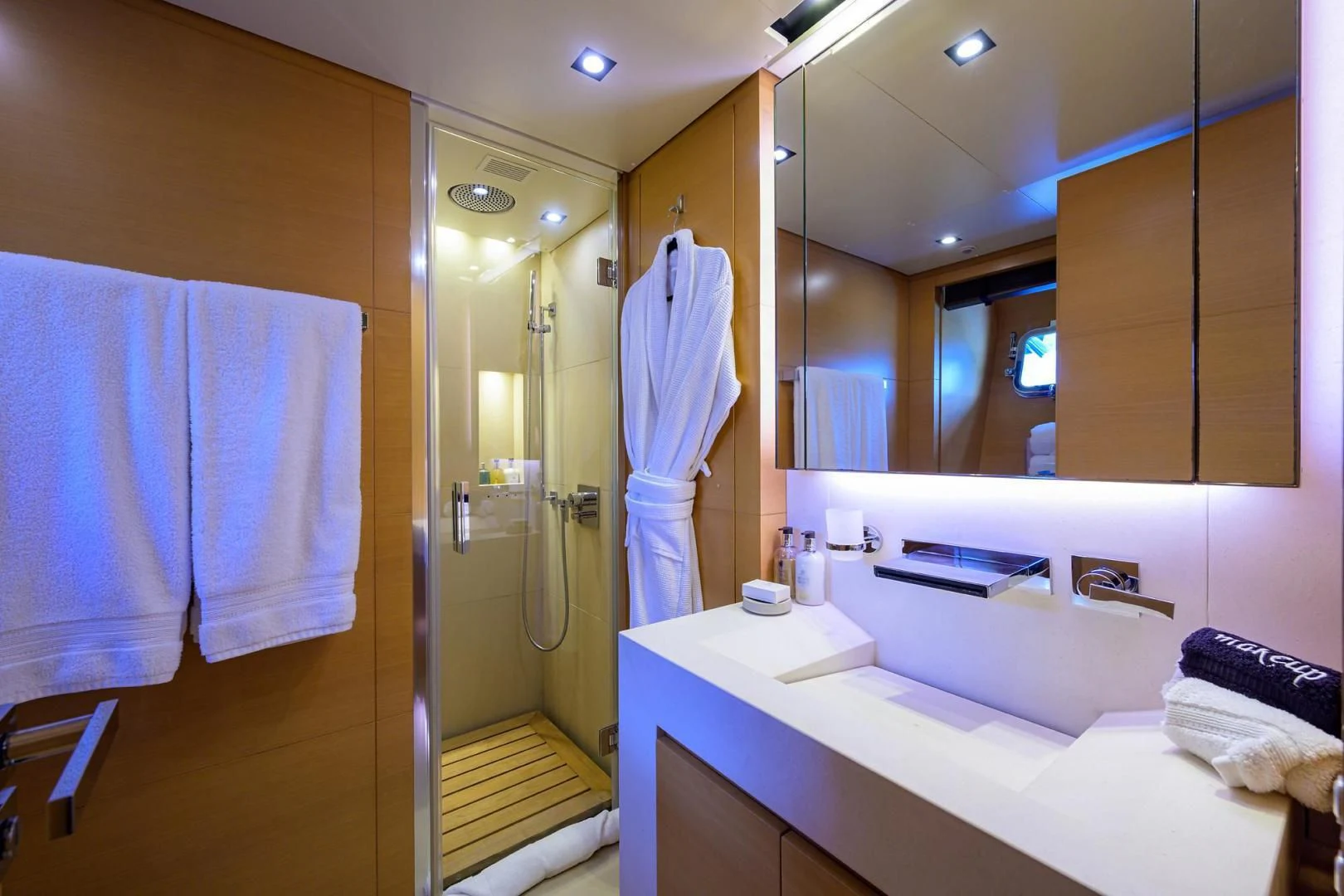a bathroom with a large mirror aboard AWAY Yacht for Charter