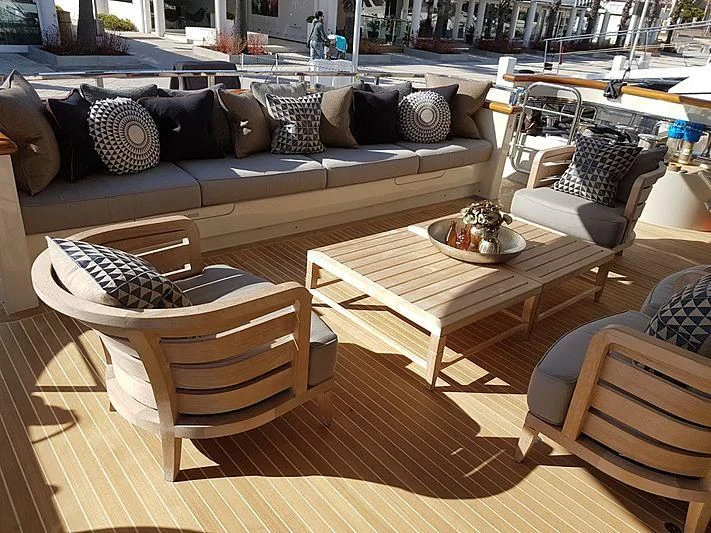 a living room with a couch and a coffee table aboard AWAY Yacht for Charter