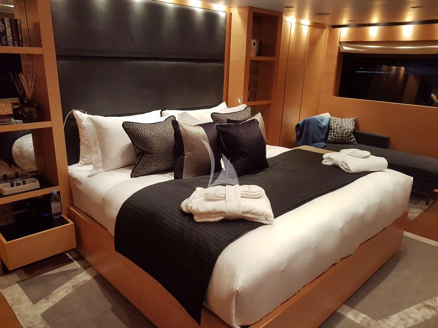a bed with pillows aboard AWAY Yacht for Charter