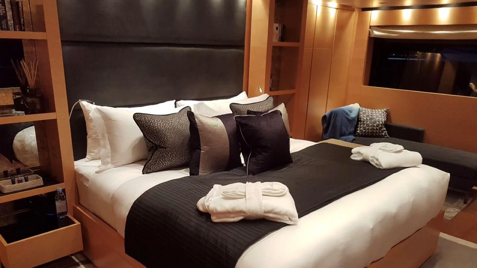 a bed with pillows aboard AWAY Yacht for Charter