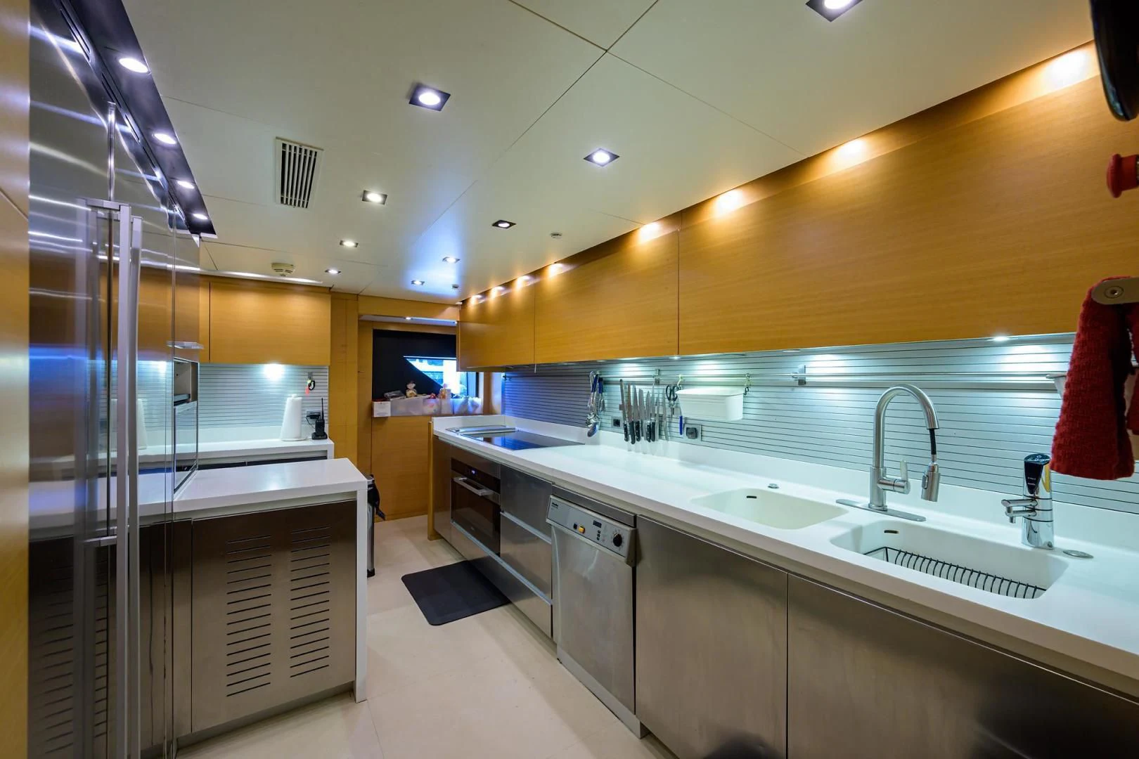 a large kitchen with stainless steel appliances aboard AWAY Yacht for Charter