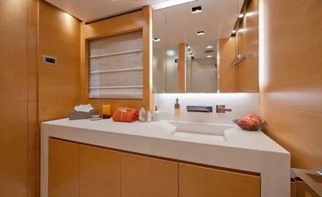 a bathroom with a large mirror aboard AWAY Yacht for Charter