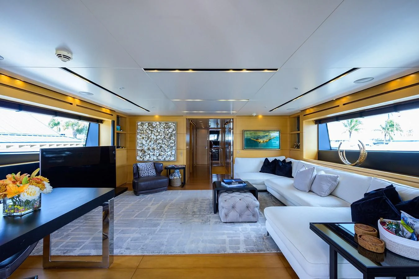a living room with a large window aboard AWAY Yacht for Charter