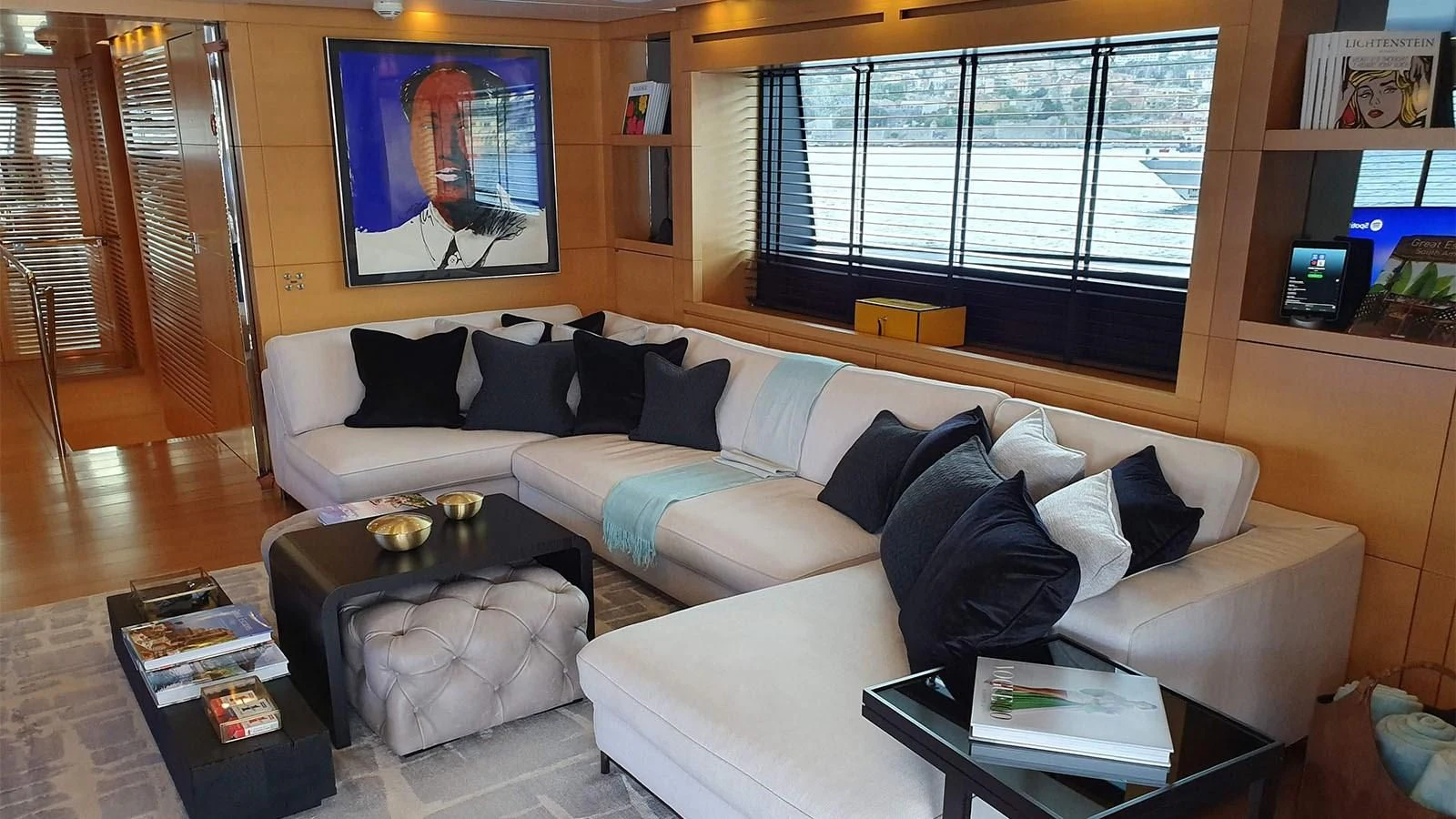 a living room with a couch and a coffee table aboard AWAY Yacht for Charter