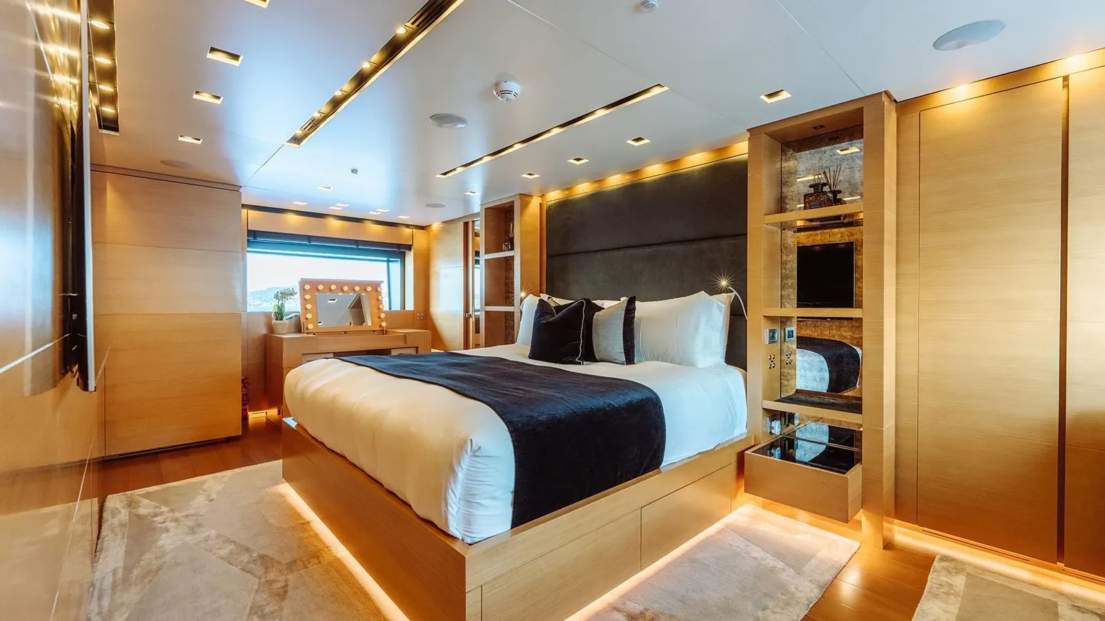 a bedroom with a large bed aboard AWAY Yacht for Charter