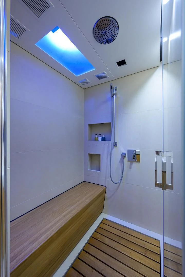 a room with a door and a light on the wall aboard AWAY Yacht for Charter