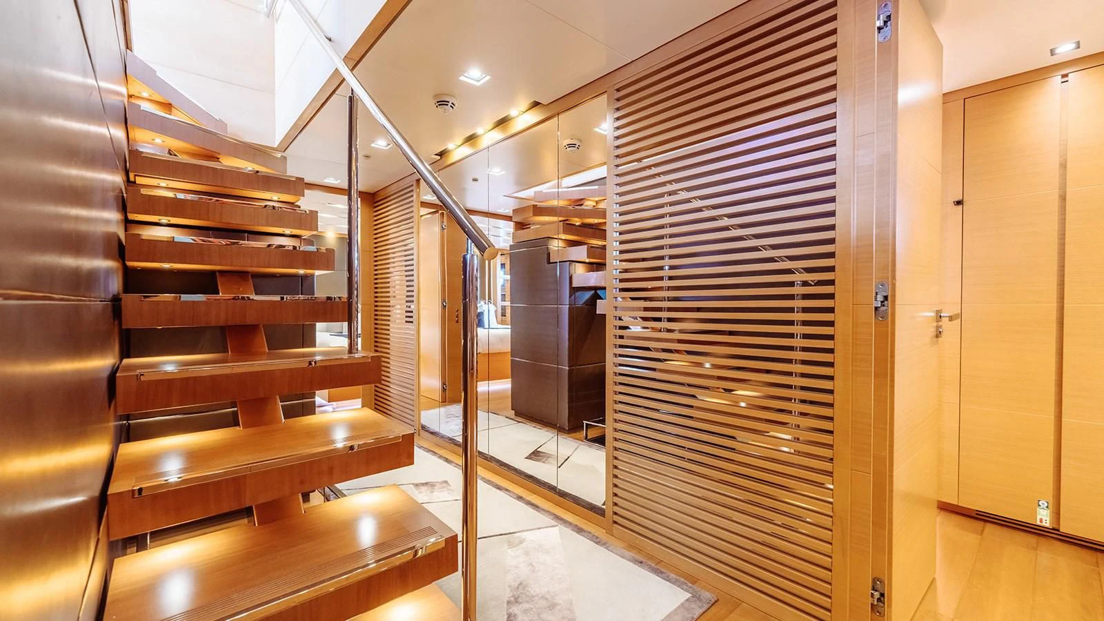 a room with wooden furniture aboard AWAY Yacht for Charter