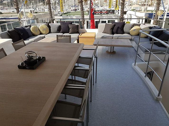 a room with a couch and a table and chairs aboard AWAY Yacht for Charter