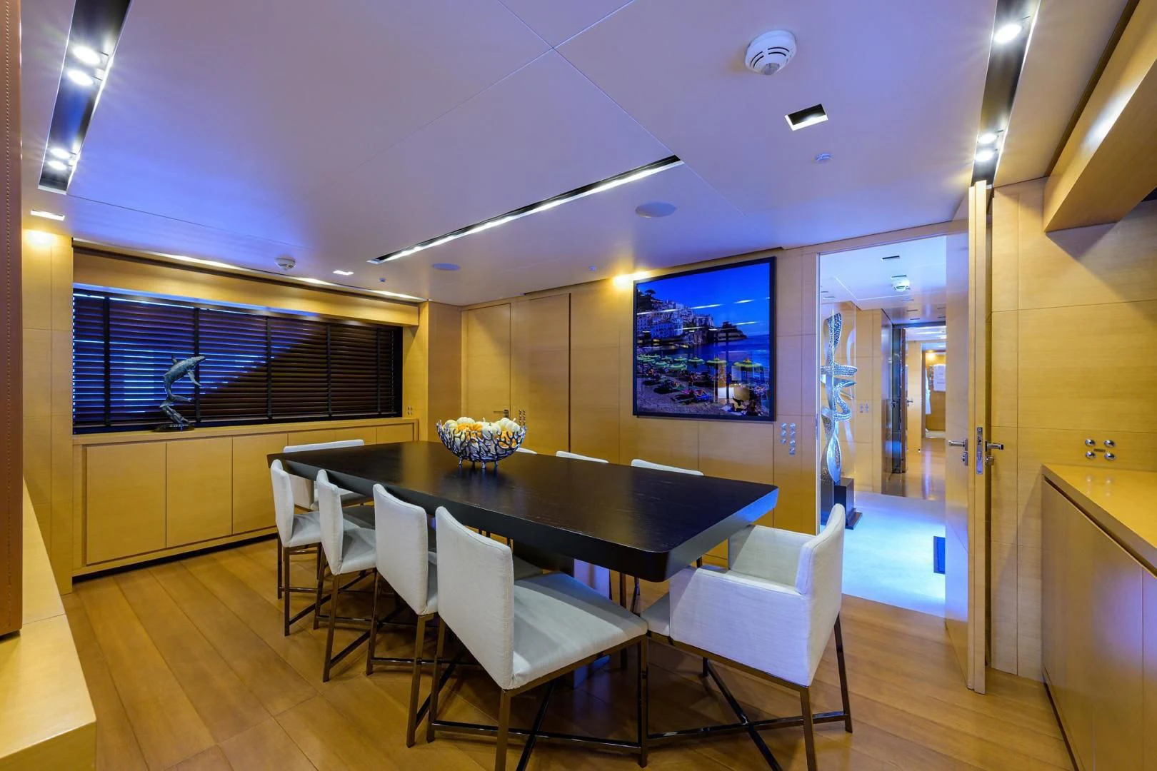 a large kitchen with a table and chairs aboard AWAY Yacht for Charter