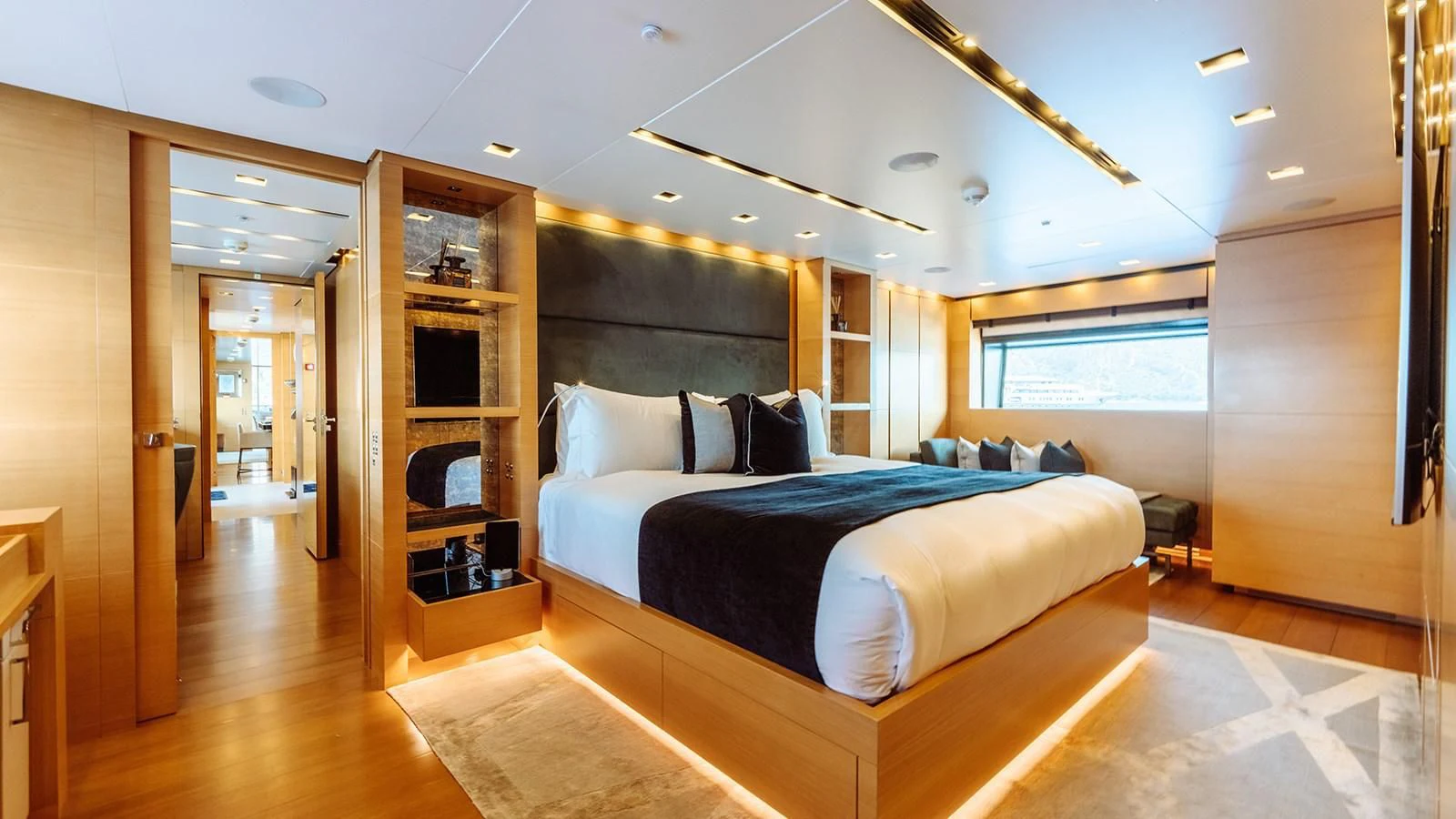 a large bedroom with a large bed aboard AWAY Yacht for Charter