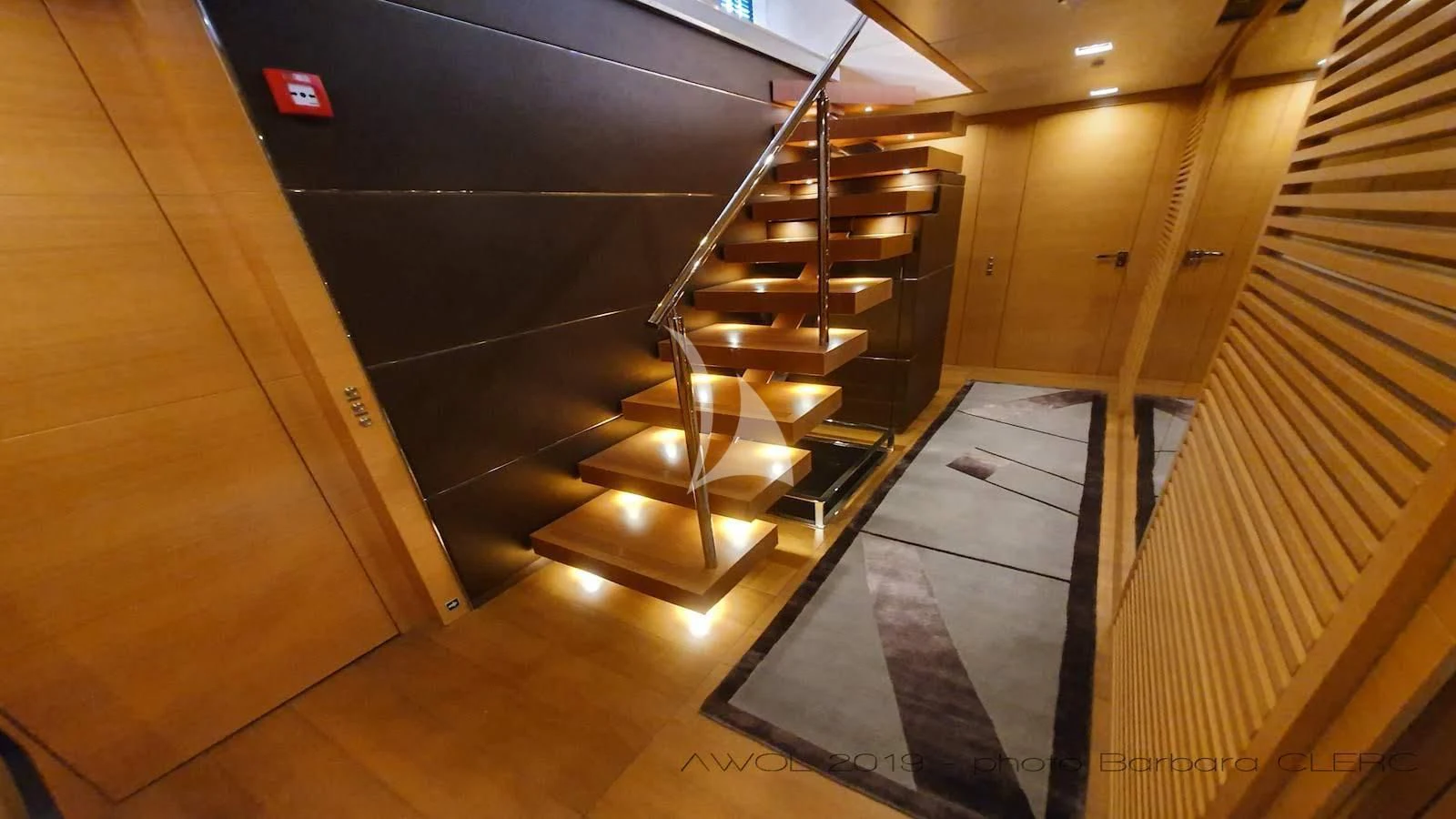 a staircase with a wood floor aboard AWAY Yacht for Charter