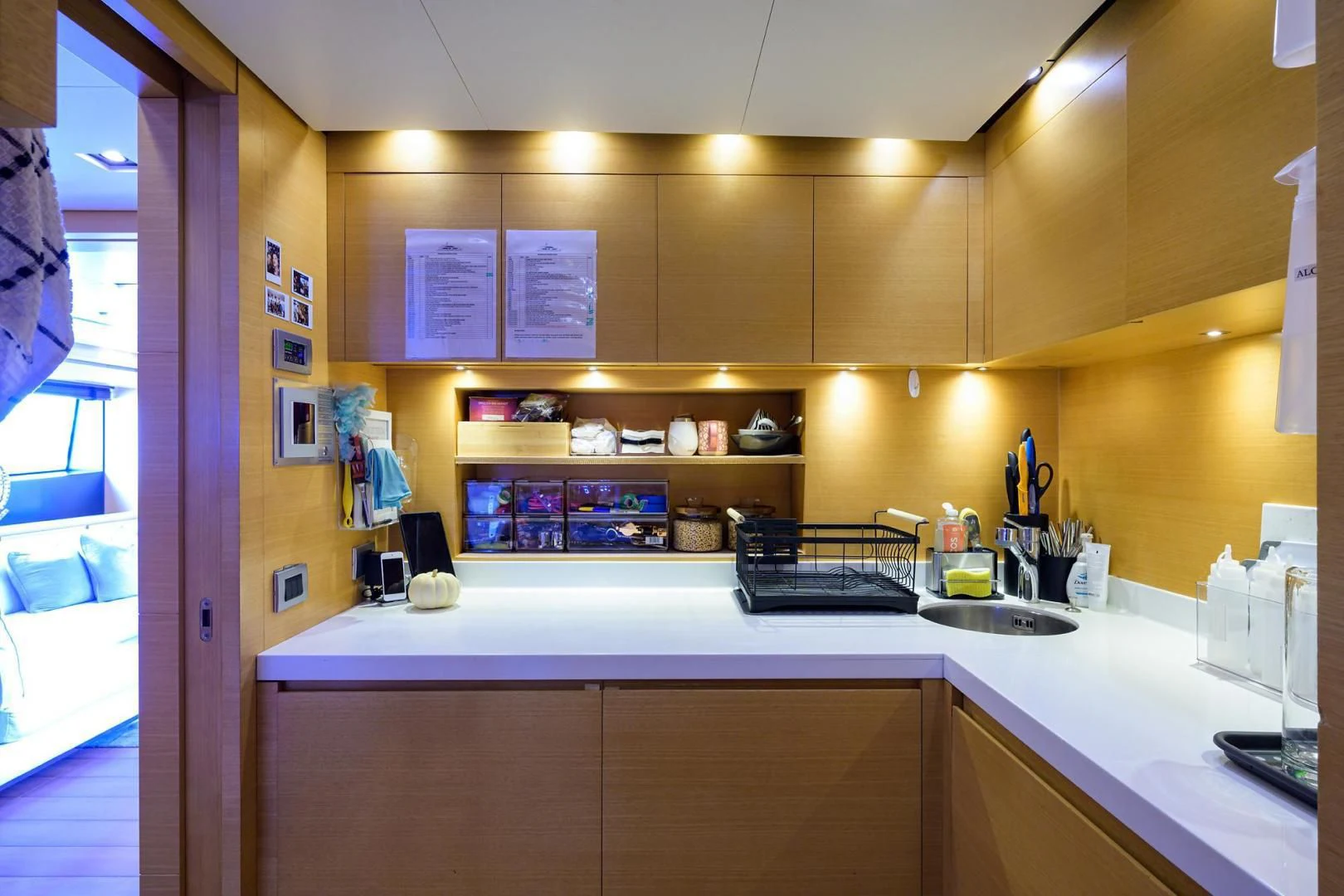 a kitchen with a sink and cabinets aboard AWAY Yacht for Charter