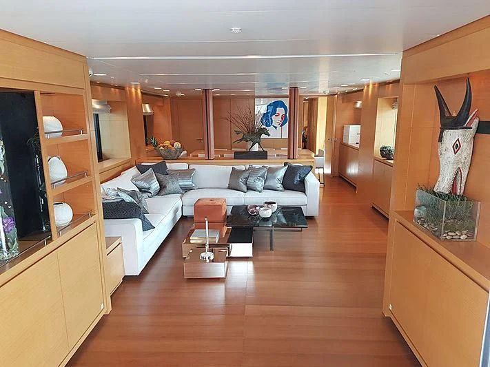 a living room with a couch and a table aboard AWAY Yacht for Charter
