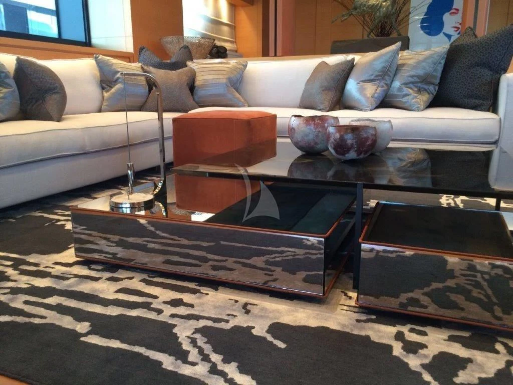 a coffee table with a glass top aboard AWAY Yacht for Charter