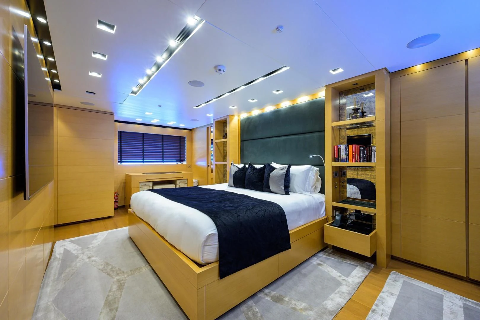 a bedroom with a large bed aboard AWAY Yacht for Charter