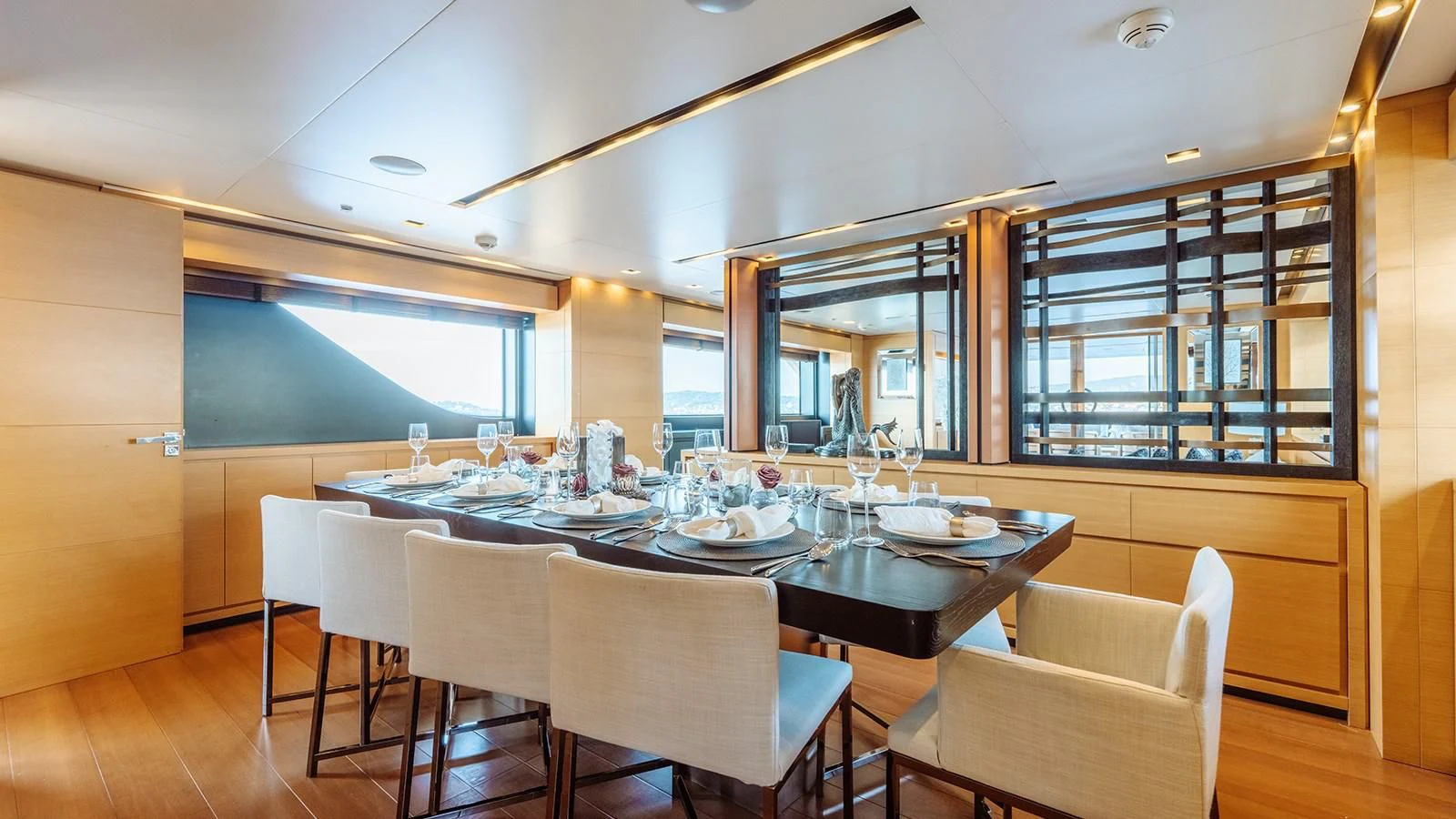 a dining table in a room aboard AWAY Yacht for Charter