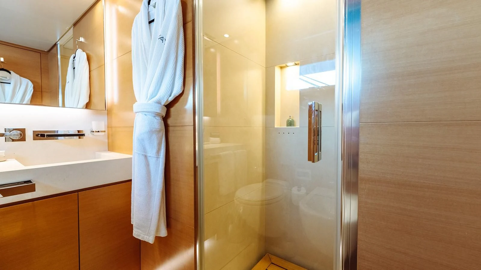a bathroom with a shower unit and sink aboard AWAY Yacht for Charter