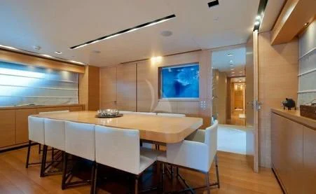 a large kitchen with a large table aboard AWAY Yacht for Charter