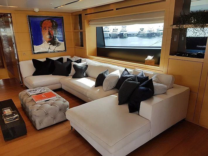 a living room with a large window aboard AWAY Yacht for Charter