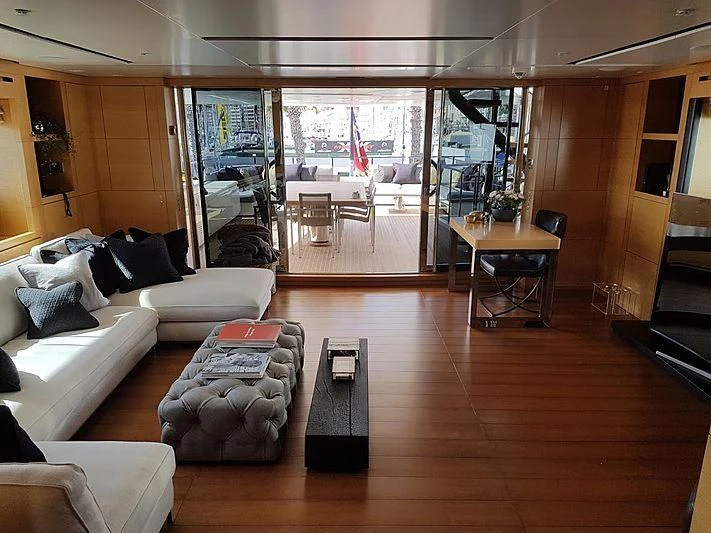 a living room with a large window aboard AWAY Yacht for Charter