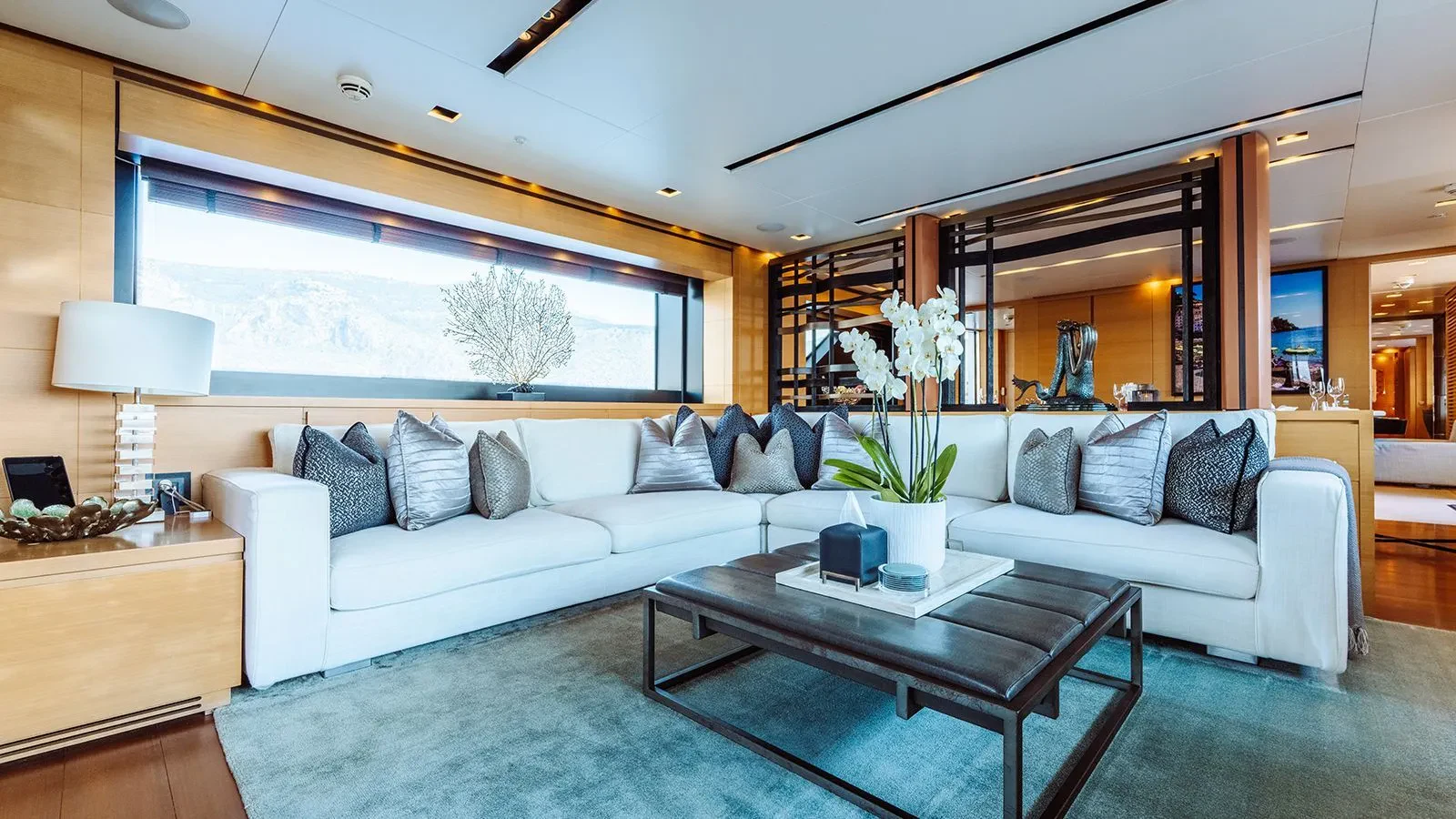 a living room with a large window aboard AWAY Yacht for Charter
