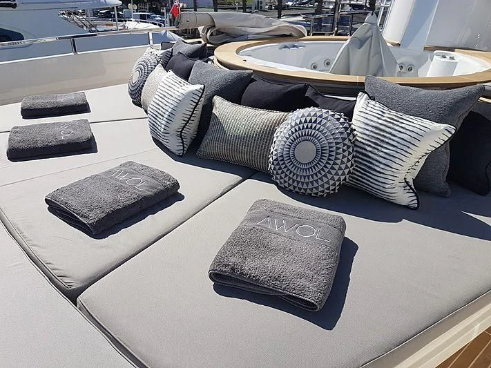 a large modern lounge chair aboard AWAY Yacht for Charter