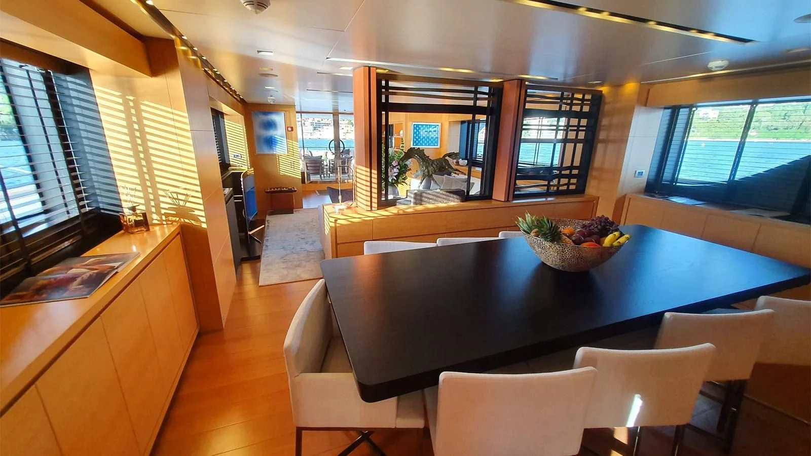 a kitchen with a table and chairs aboard AWAY Yacht for Charter