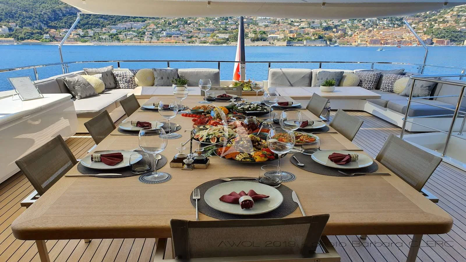 a table with plates and food on it aboard AWAY Yacht for Charter
