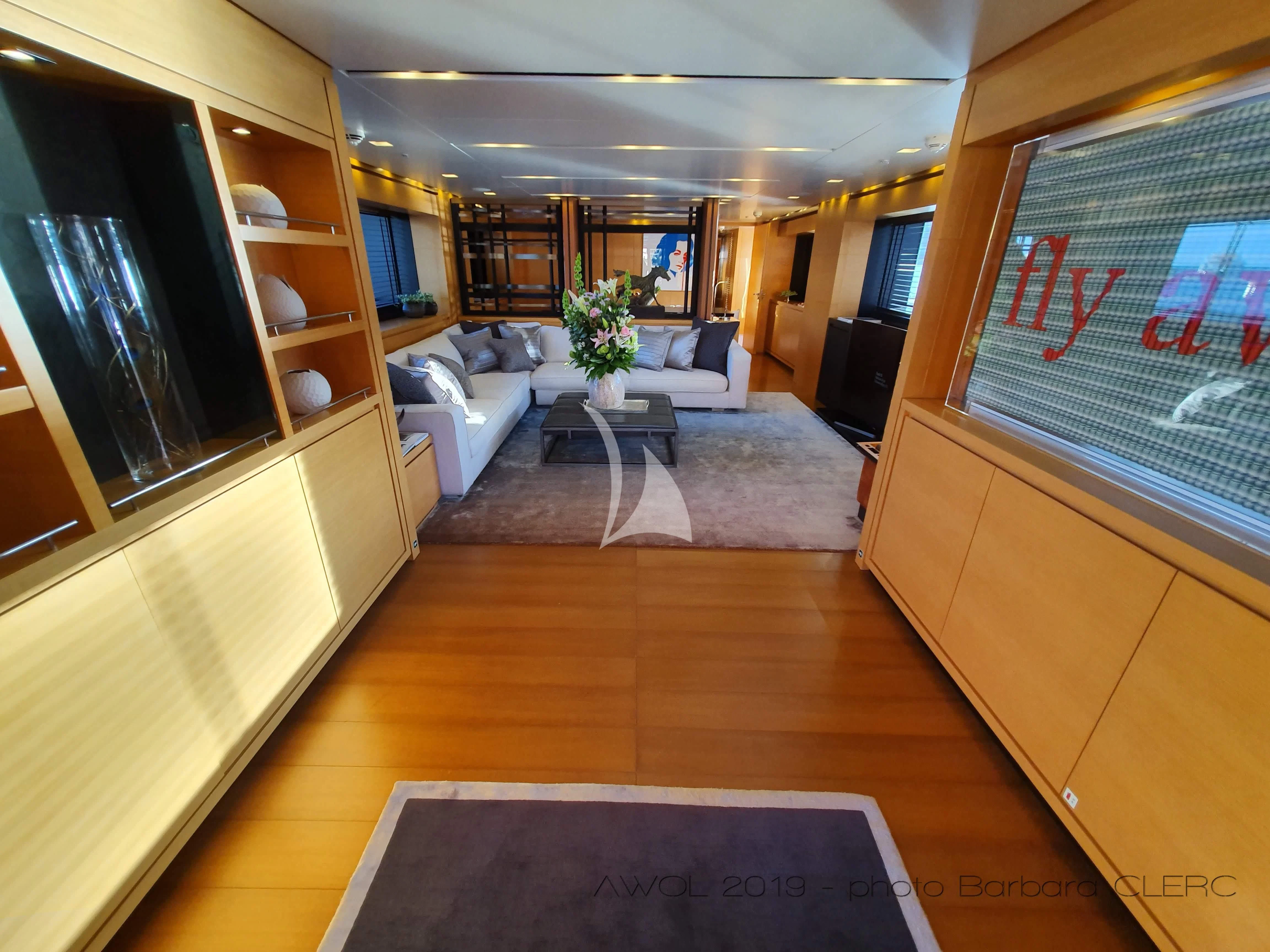 a living room with a large window aboard AWAY Yacht for Charter