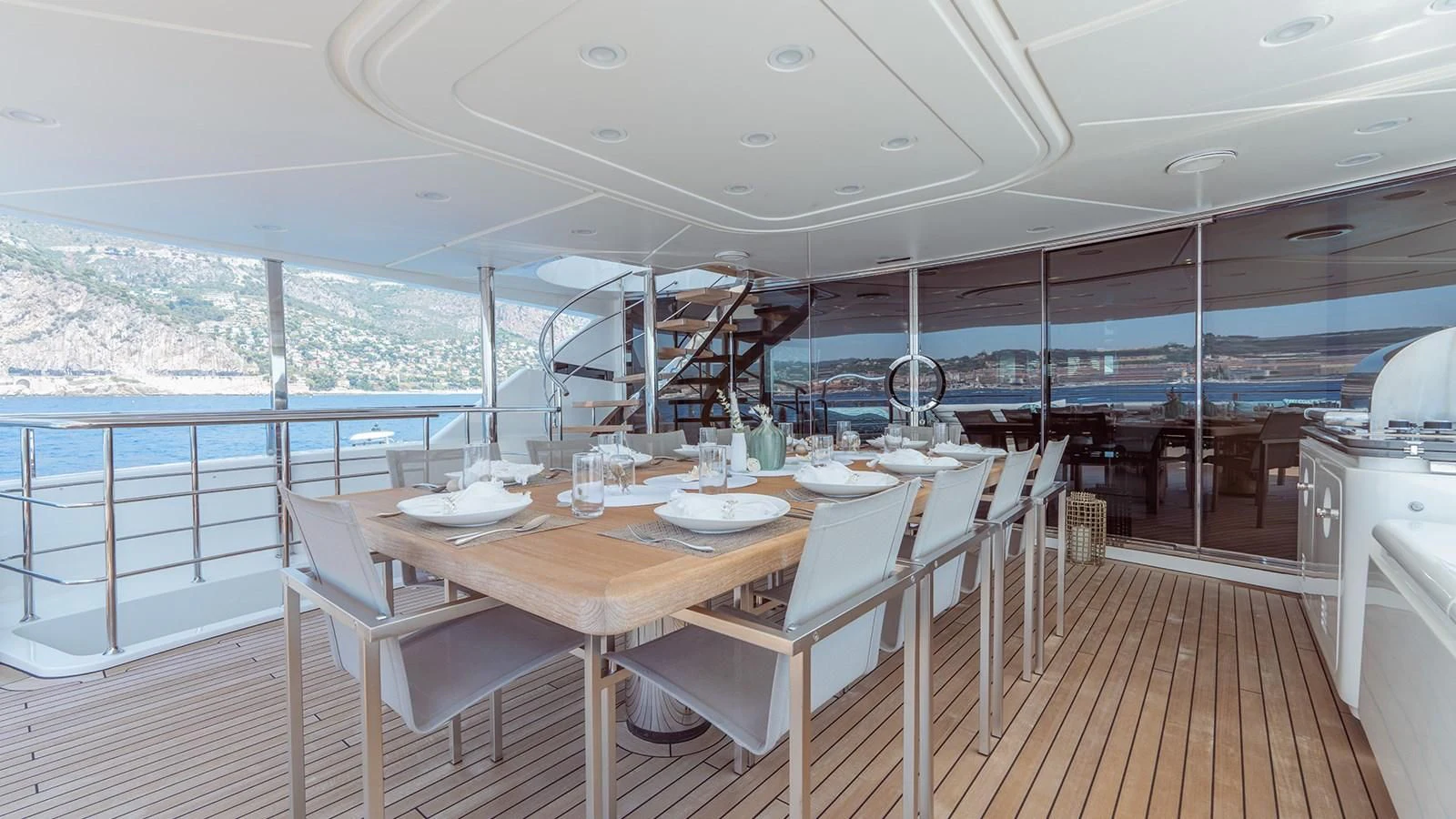 a table set for a meal on a deck aboard AWAY Yacht for Charter
