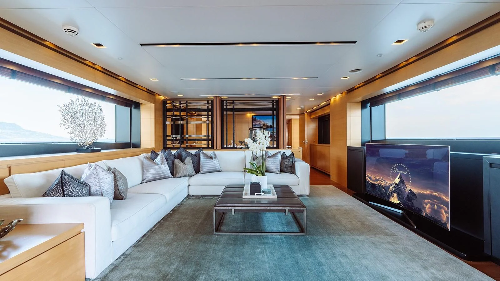 a living room with a large fireplace aboard AWAY Yacht for Charter