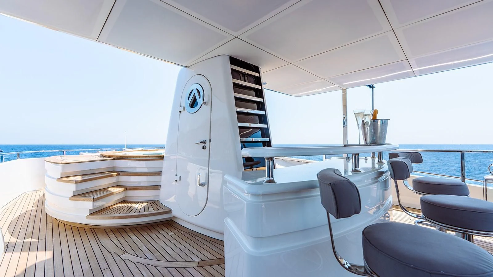 a white boat on a deck aboard AWAY Yacht for Charter