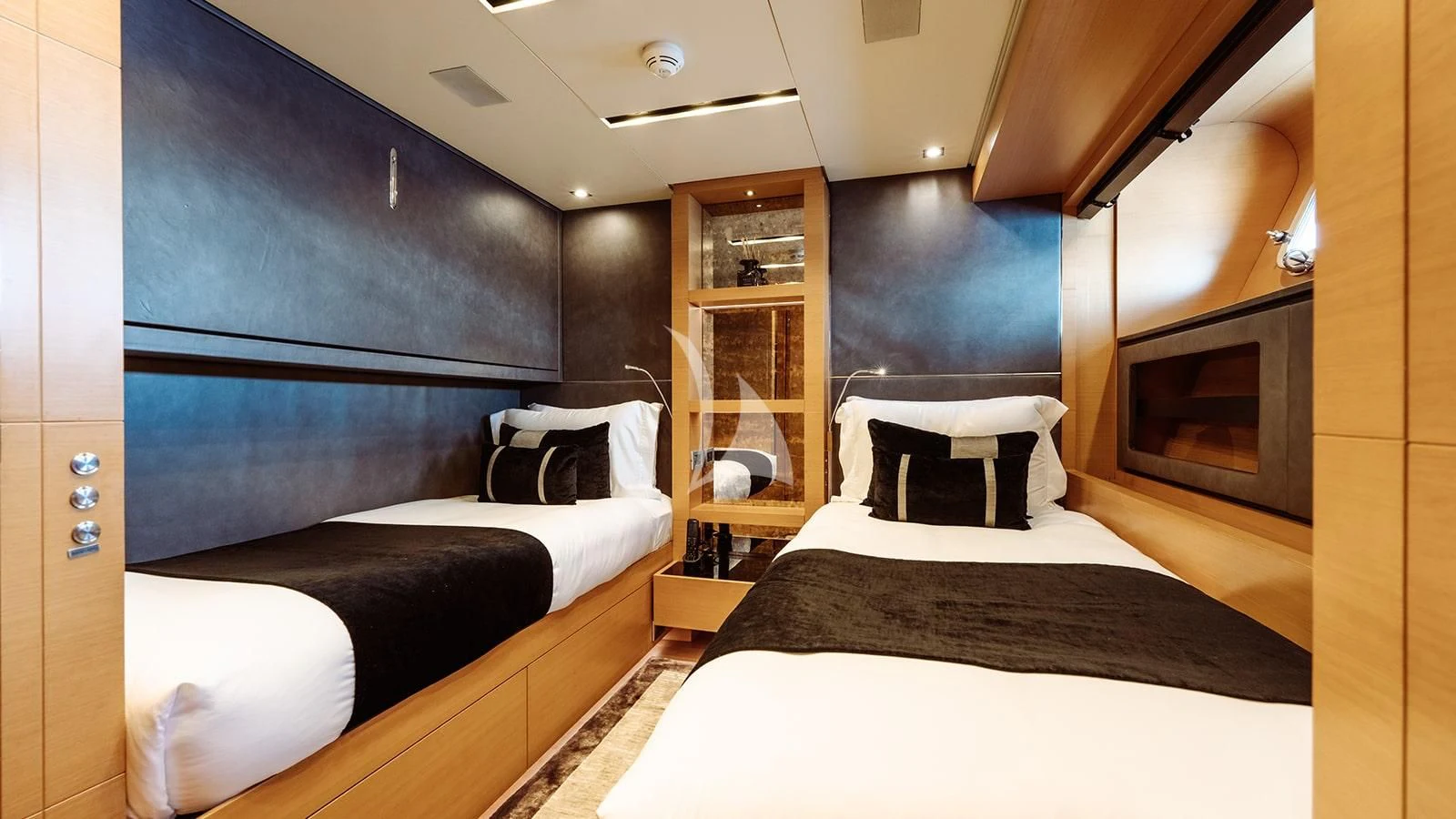 a room with a bed and a fireplace aboard AWAY Yacht for Charter